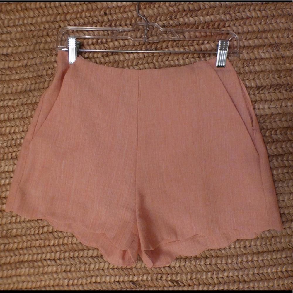 Peachy pink shorts with a scalloped hem!